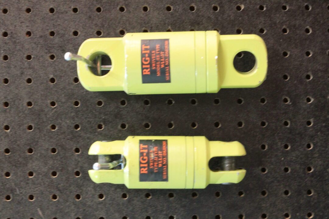 Canyon Rigging Angular Bearing Swivel product photo. the product is hung on a display. the angular bearing swivel is a green colour and includes two products.