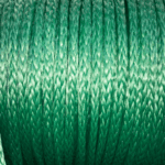 Dyneema Synthetic Rope the rope is green and is in a roll. This synthetic rope is braided.