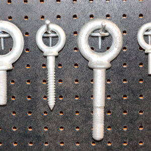 product photo of Canyon Rigging eye bolts displayed on product wall. There are multiple sizes displayed.