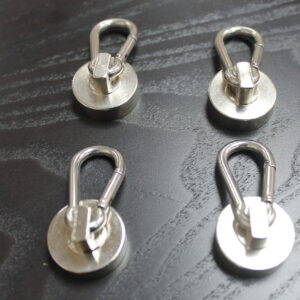 Product photo of Canyon Rigging Flag Magnets. There are four magnets oriented on a table. They all have carabiner clips.