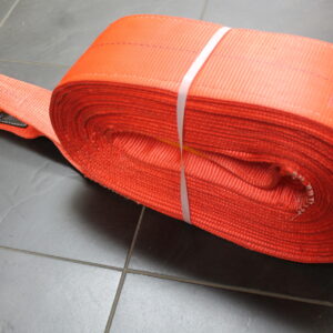 Canyon Rigging Product photo showing Canyon Rigging Rig-It Tow Straps wound up in prepped for sale. The Strap is orange with a yellow connector.