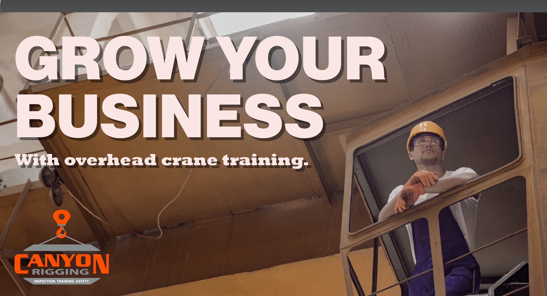 picture of a man sitting in a overhead crane cockpit. with the caption "grow your business with overhead crane training. Canyon Rigging logo in the corner.