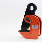 Feature photo of Canyon Rigging's Horizontal Plate Clamp. THe plate clamp has an orange body and a black clip. the background is a off grey white.