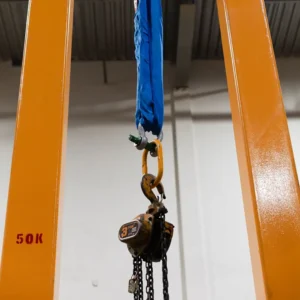 CAnyon Rigging photo of a vertical test bed with a chain hoist on it being tested