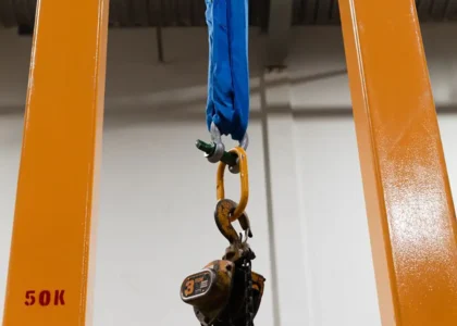 CAnyon Rigging photo of a vertical test bed with a chain hoist on it being tested